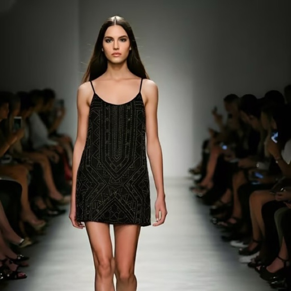 Black beaded sleeveless mini
dress with spaghetti straps #glamour Forever 21 M